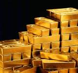 انخفاض أسعار الذهب بشكل طفيف مع ارتفاع الدولار