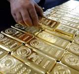 انخفاض أسعار الذهب لأقل مستوى في ثلاثة أسابيع عند التسوية