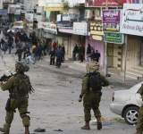 اشتباكات مسلحة ومداهمات واعتقالات بالضفة الغربية
